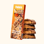 Felora Crunchy Hazelnut chocolate bar — styled composition
